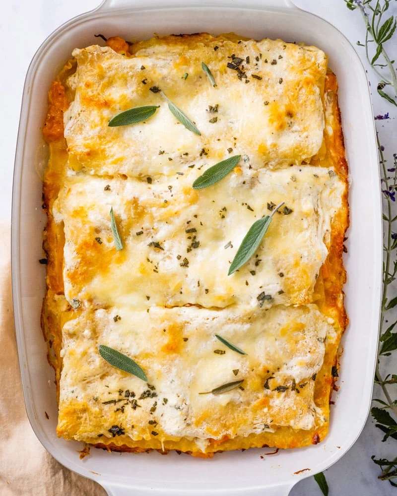 Warm butternut squash lasagna with creamy béchamel, sage, and mozzarella topping