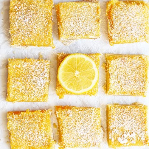 Sun‑kissed lemon bars with buttery crust, vibrant lemon curd, powdered sugar dusting