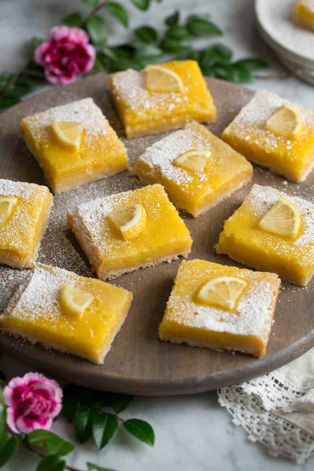 Light shortbread crust, bright lemon curd, dusted with powdered sugar