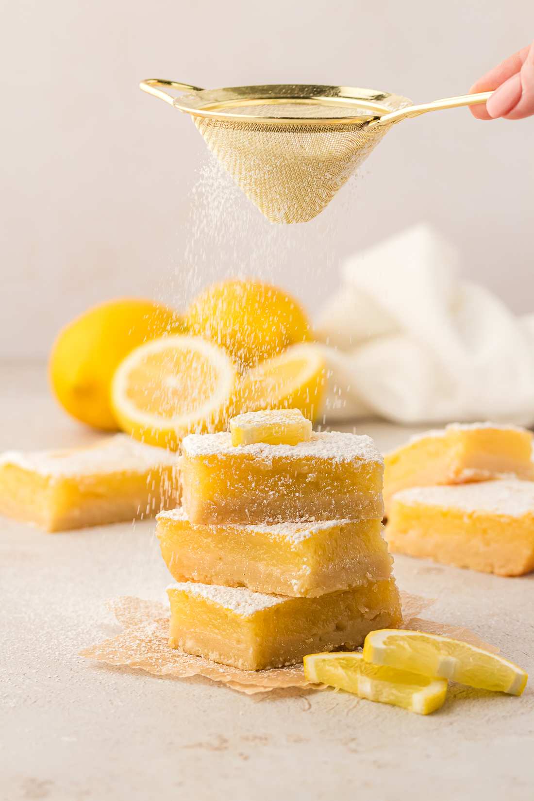 Golden shortbread crust, tangy lemon curd, lightly powdered sugar topping