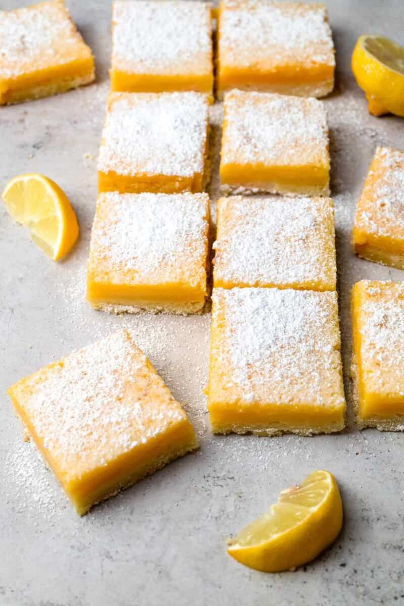 Gluten‑free shortbread crust, bright lemon curd, dusted with powdered sugar