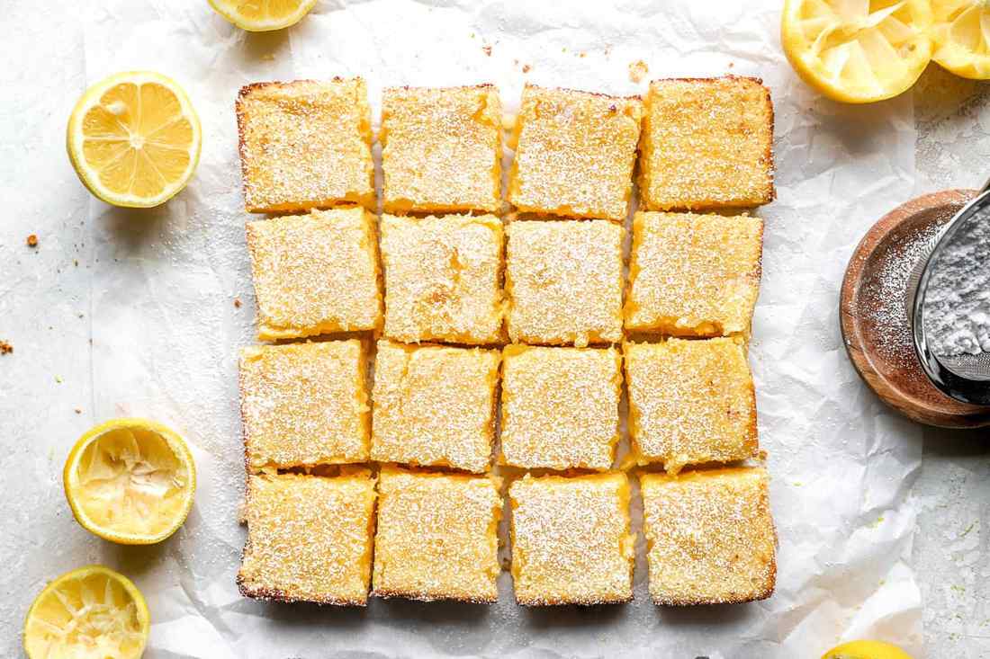 Light gluten‑free crust, vivid lemon curd, powdered sugar dusting