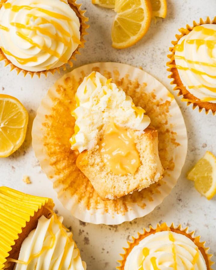 Moist lemon cupcakes topped with a swirl of bright lemon curd and frosting