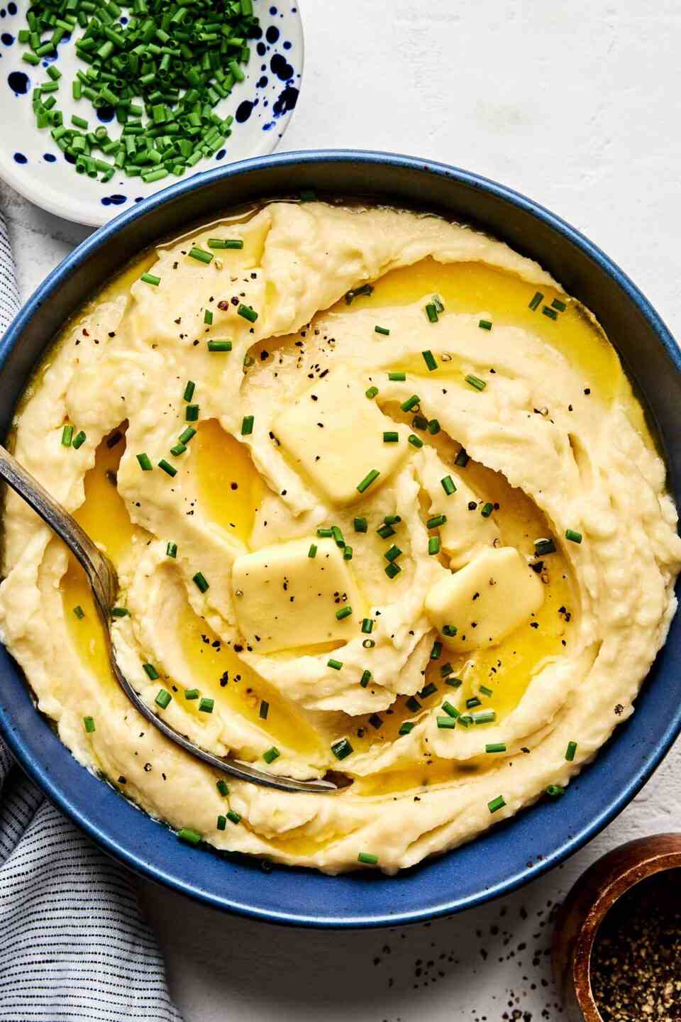 Rustic skin-on mashed potatoes tossed with garlic butter and flecked with fresh parsley