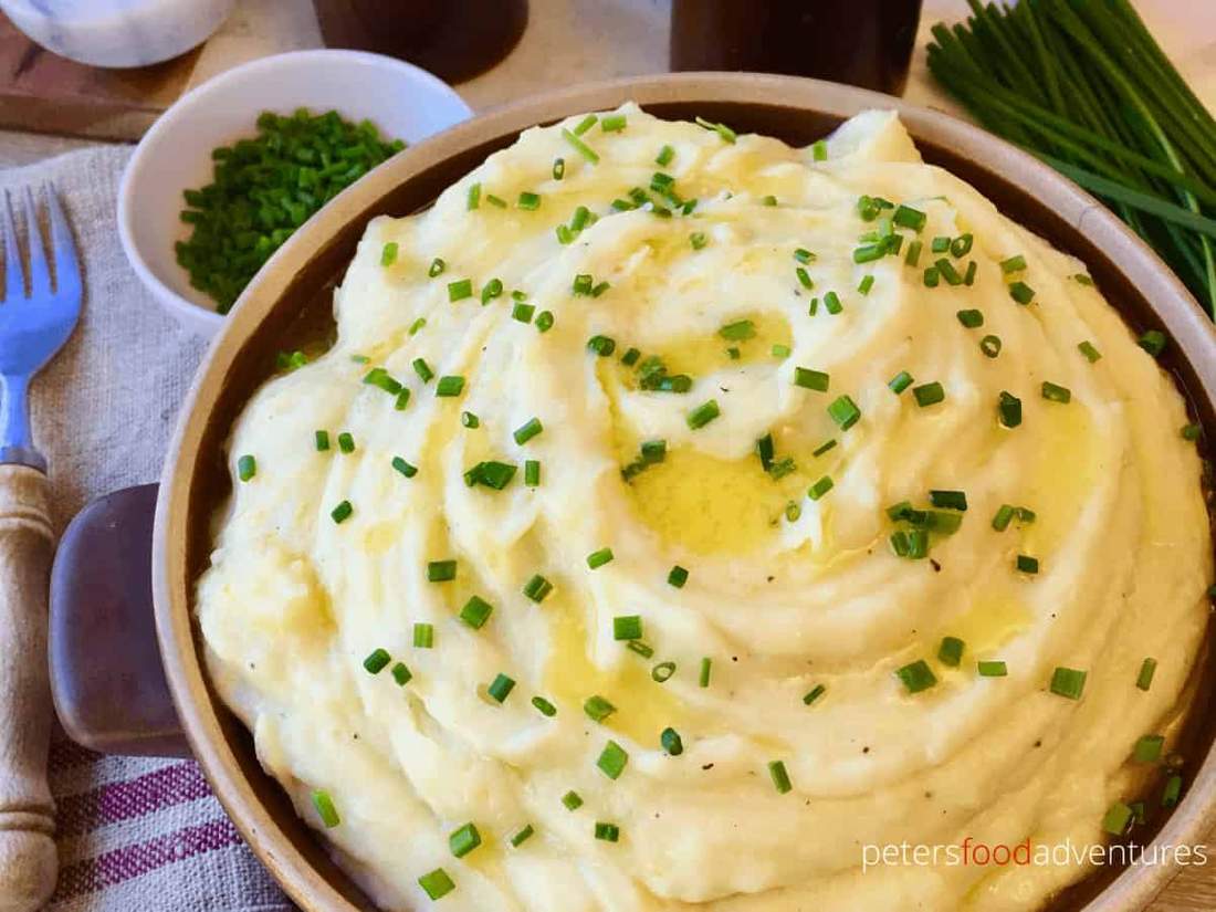 Silky mashed potatoes whipped with tender garlic confit cloves and aromatic herb oil