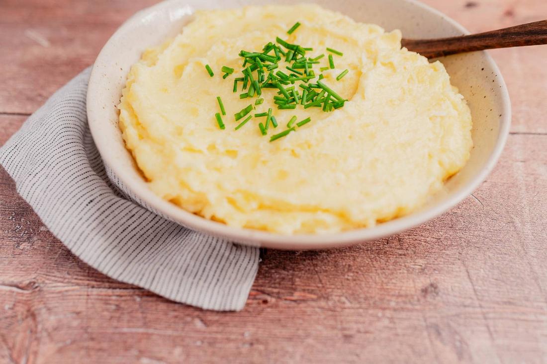 Rich mashed potatoes blended with melted Asiago and Parmesan cheeses, finished with green onions