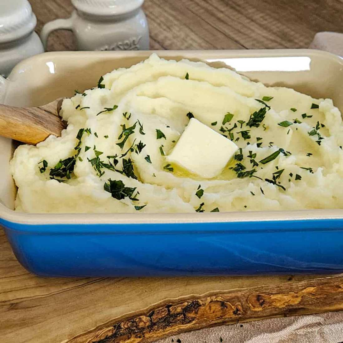 Gourmet mashed potatoes drizzled with white truffle oil, grated Parmesan cheese, and fine chives