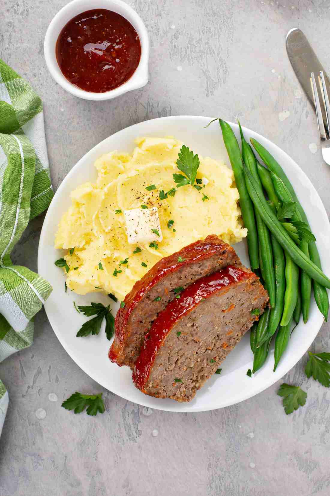 Classic beef meatloaf, cheddar crust, garlic-infused glaze, juicy beef, family comfort food