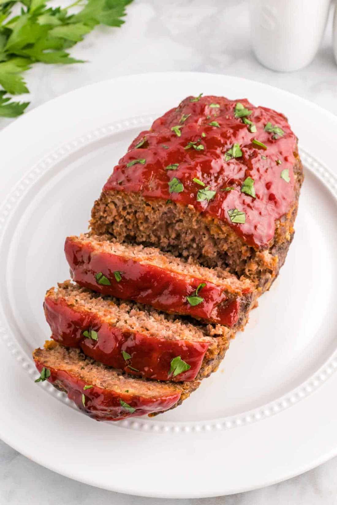 Juicy classic beef meatloaf topped with sweet smoky tomato glaze, golden crust, and tender interior