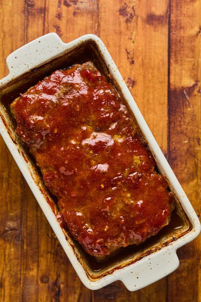 Classic beef meatloaf glazed with smoky BBQ sauce, juicy center, comforting family meal