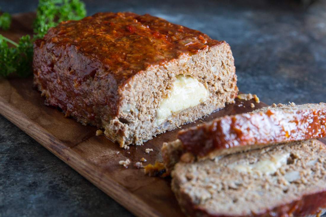 Cheesy meatloaf with golden crust, melted cheddar, and savory beef filling, a comforting family favorite
