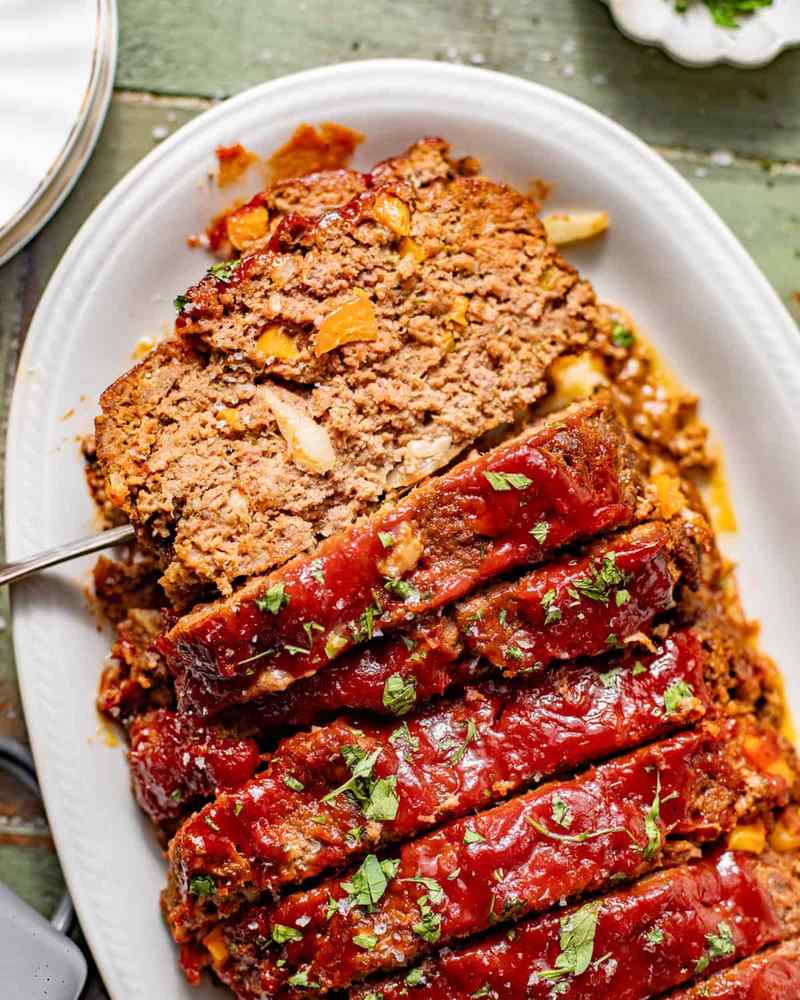 Juicy BBQ meatloaf with a glossy sweet glaze, smoky aroma, and tender crumb