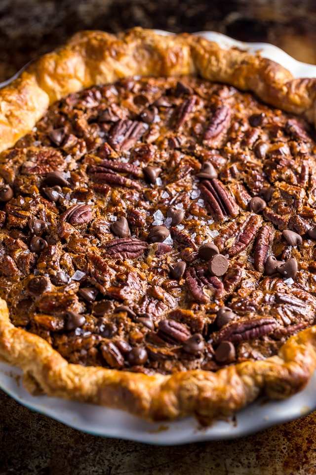 Golden classic pecan pie accented with sliced toasted almonds and caramel custard
