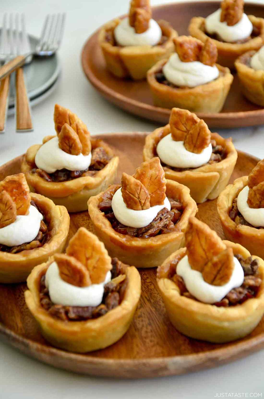 Individual mini pecan pies baked in muffin tins with gooey caramel filling
