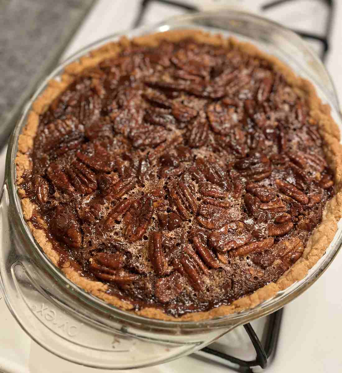 Signature golden classic pecan pie slice on holiday dessert table