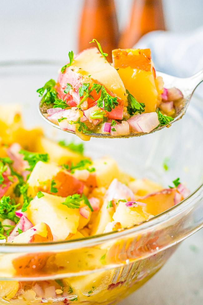 Warm German potato salad, tender potatoes, tangy vinegar dressing, crisp bacon, fresh parsley