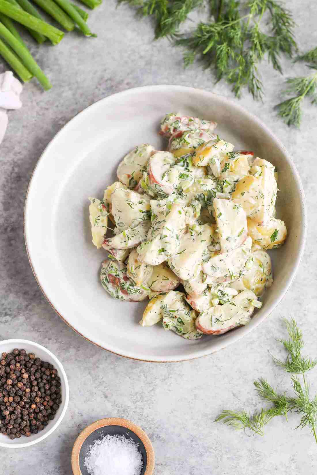 Classic creamy potato salad with tender potatoes, rich mayo dressing, crunchy celery, and fresh chives