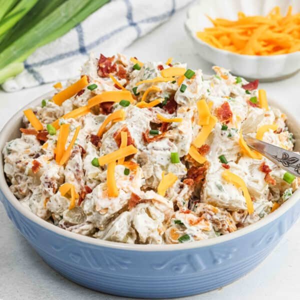 Loaded baked potato salad with tender potatoes, cheddar, bacon, green onions, and creamy ranch dressing