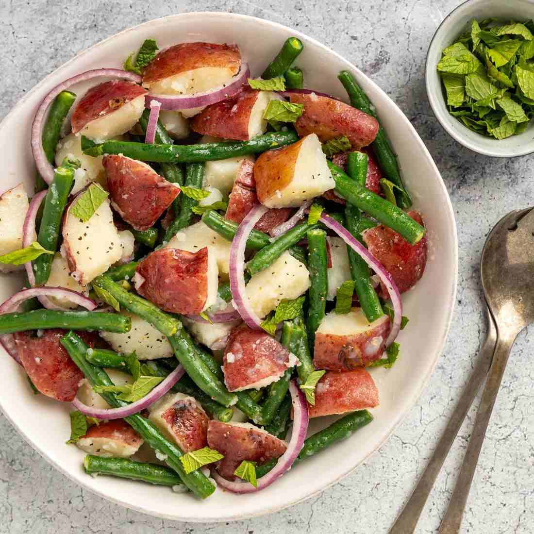Classic creamy potato salad with tender potatoes, creamy dressing, fresh herbs, and crunchy celery