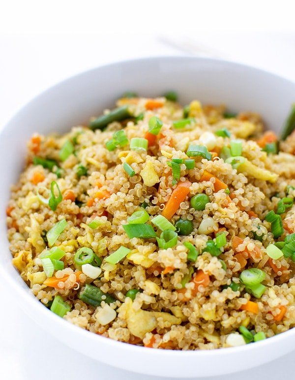 Colorful vegetable quinoa fried rice with fluffy quinoa, crisp carrots, peas, and a soy glaze