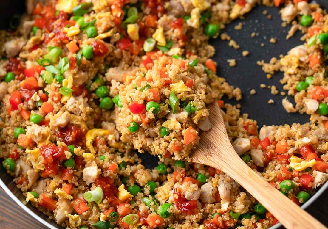Chicken quinoa fried rice with fluffy grains, tender chicken, and a soy‑ginger glaze