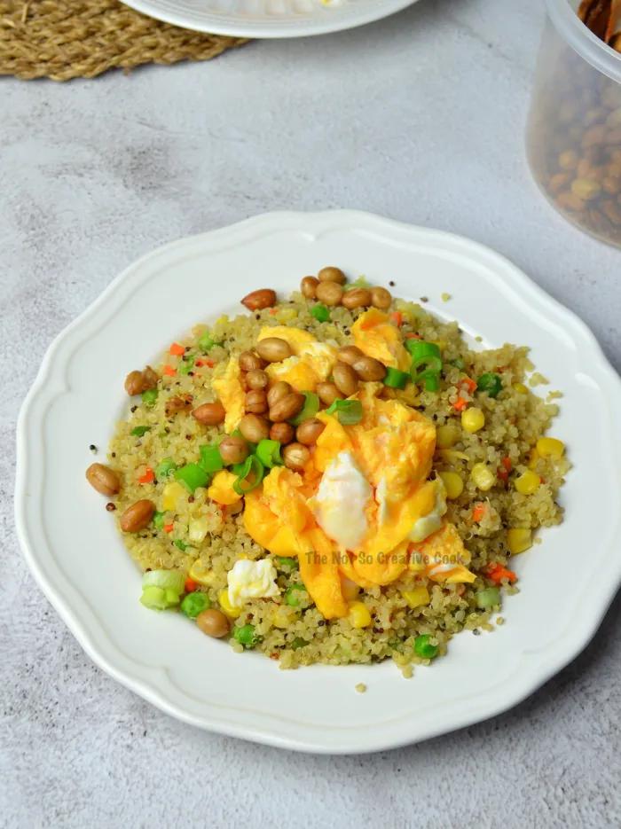 Garden fresh quinoa fried rice with fluffy grains, crisp veggies, and soy glaze