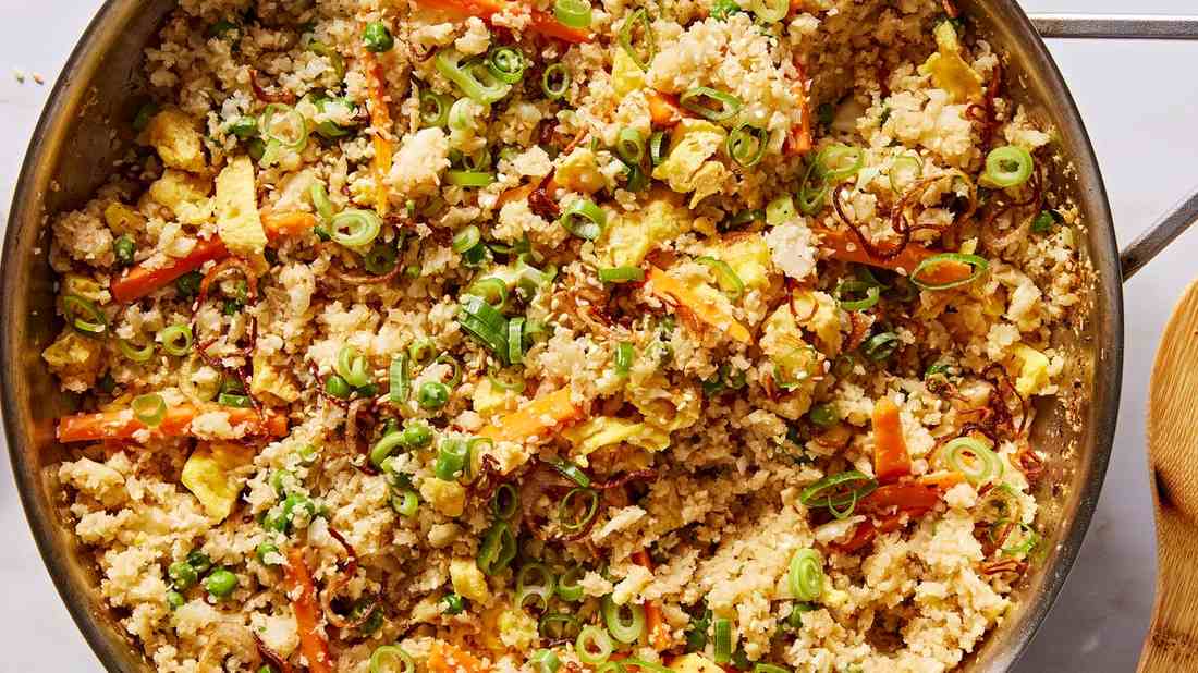 Cauliflower quinoa fried rice with fluffy grains, cauliflower florets, and soy glaze