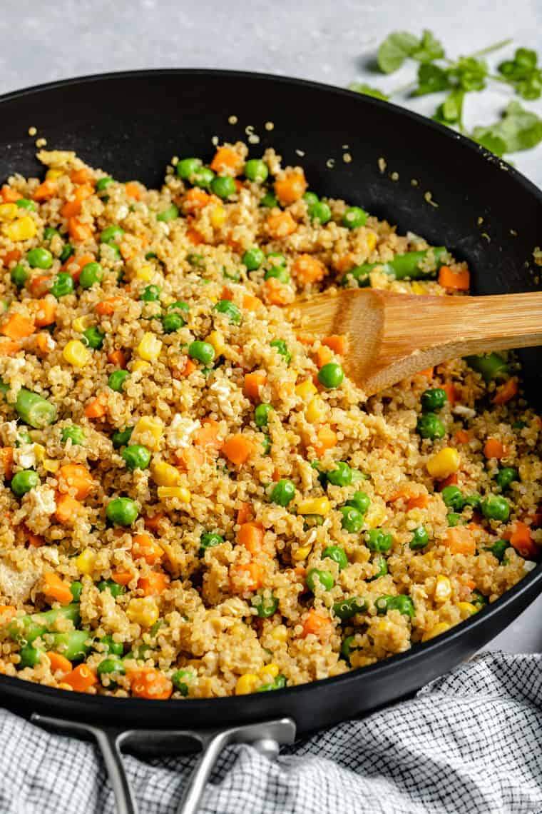 Mediterranean quinoa fried rice with olives, sun-dried tomatoes, and feta.