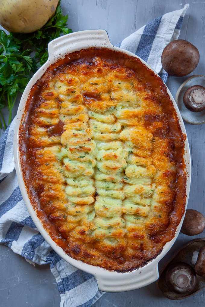 Golden mashed potato topped homestyle shepherd's pie with savory beef filling, bubbling cheese
