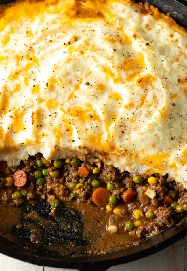 Golden mashed potato crowned ground beef cottage pie with savory filling, bubbling cheese, warm casserole