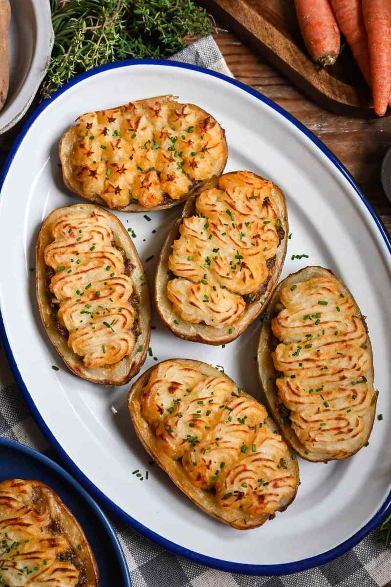 Golden mashed potato‑topped homestyle shepherd’s pie with savory beef filling, bubbling cheese, warm casserole