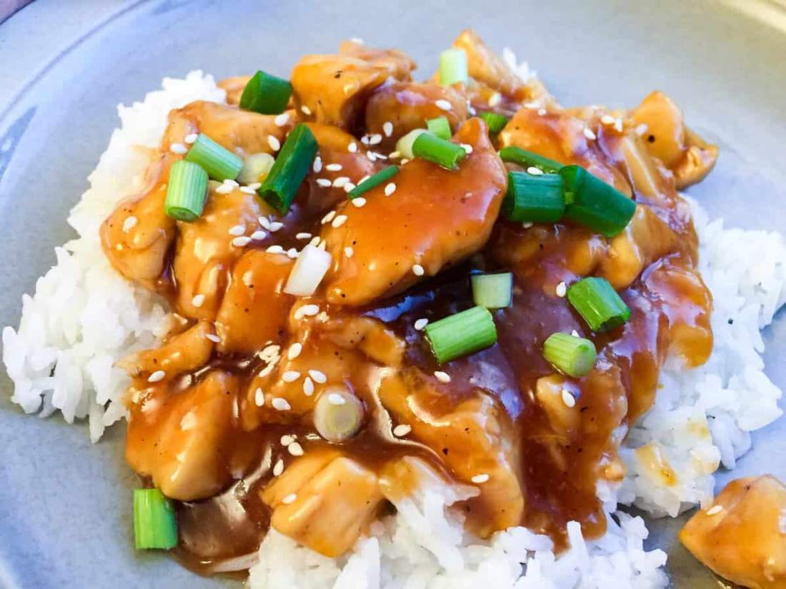 Chicken glazed in orange sauce served atop a bed of crunchy carrots and broccoli