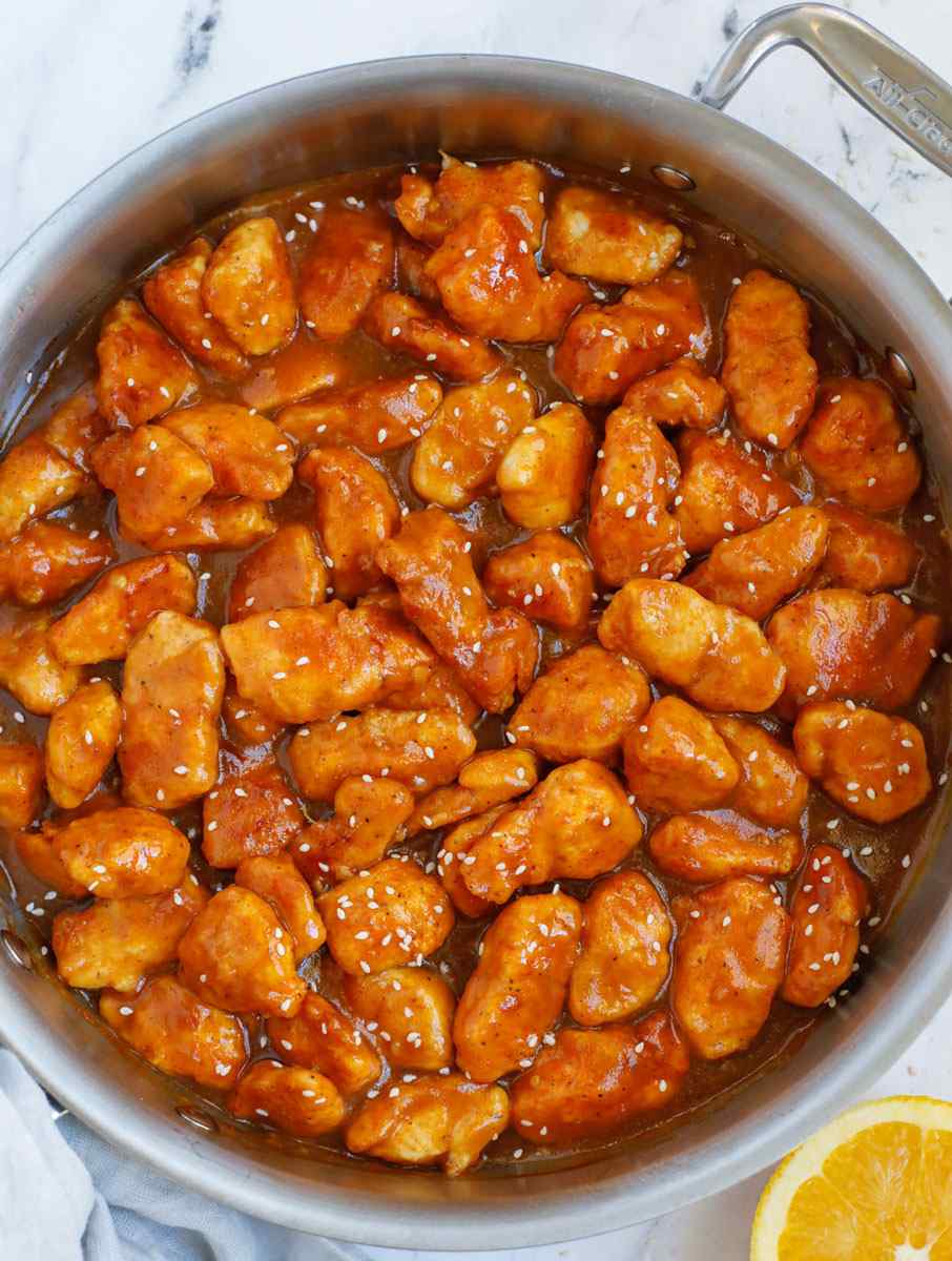Orange‑glazed chicken served over fragrant coconut rice with a sprinkle of fresh cilantro