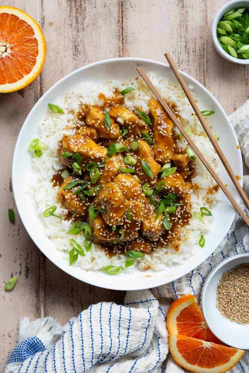 Crispy orange‑glazed chicken pieces cooked in an air fryer, served with a sprinkle of sesame seeds