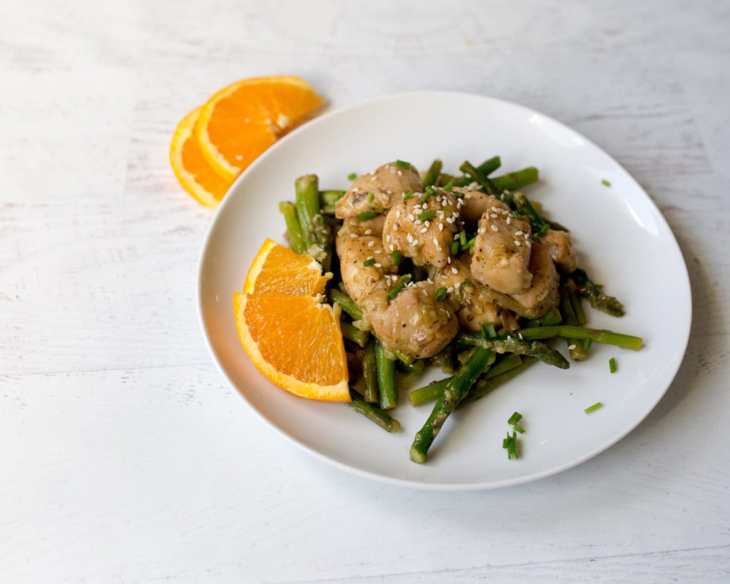 Orange‑glazed skinny chicken served over fragrant coconut rice with fresh orange garnish