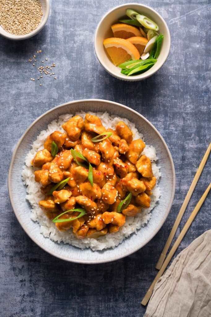 Orange‑glazed skinny chicken served over lemon‑ginger rice with fresh orange garnish