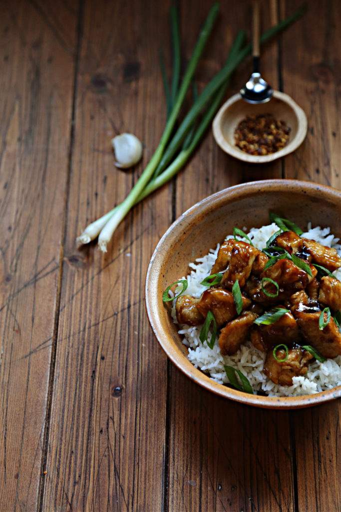 Orange‑glazed skinny chicken served over cauliflower rice with fresh orange garnish