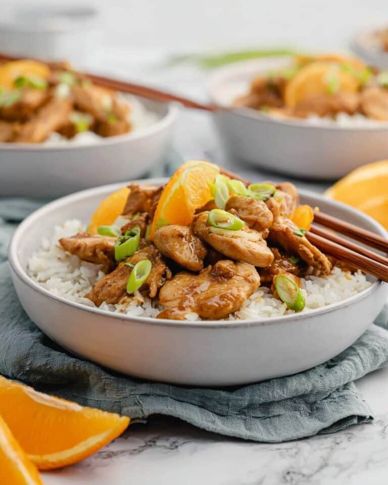 Orange‑glazed skinny chicken served over zucchini noodles with fresh orange zest