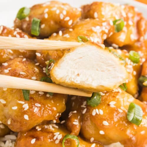 Orange‑glazed skinny chicken served over roasted asparagus from the air fryer with fresh orange zest