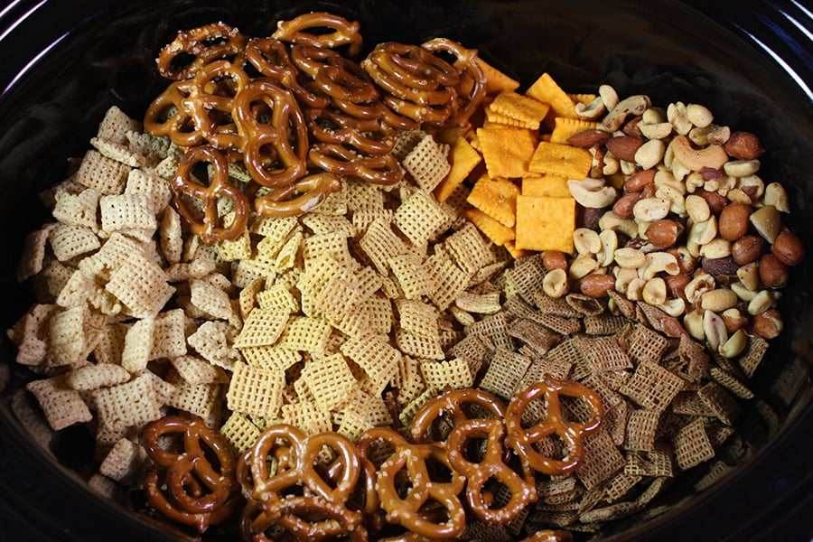 Spicy chili Chex mix with pretzels, peanuts, butter, and chili seasoning