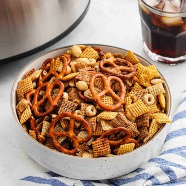 Sweet chili Chex mix with pretzels, almonds, butter, and sweet chili glaze