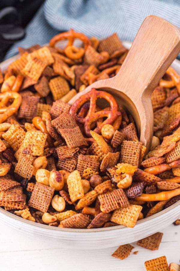 Classic slow cooker chex mix with crunchy Chex cereal, pretzels, nuts, buttery coating, and savory aroma