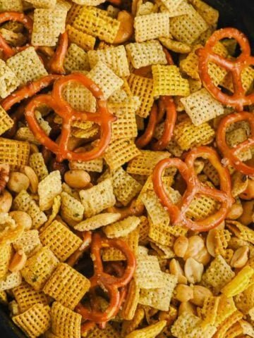 Extra‑crunch Chex mix with pretzel nuggets, peanuts, butter, and seasoned salt