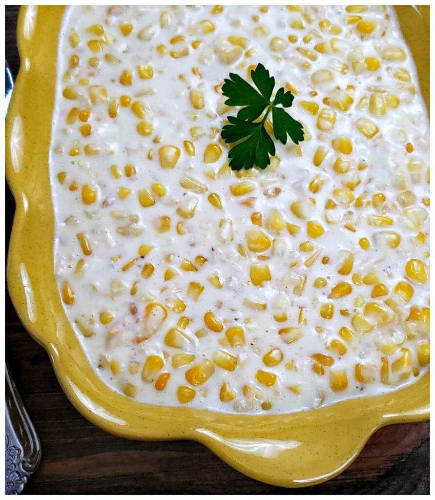 Thanksgiving creamed corn side with maple syrup, toasted pecans, buttery creamy sauce, festive crockpot side