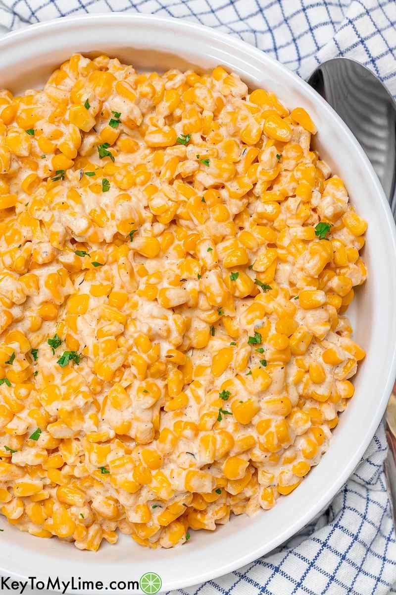 Creamy sweet corn side dish with buttery sauce, perfect for Thanksgiving, slow cooker delight
