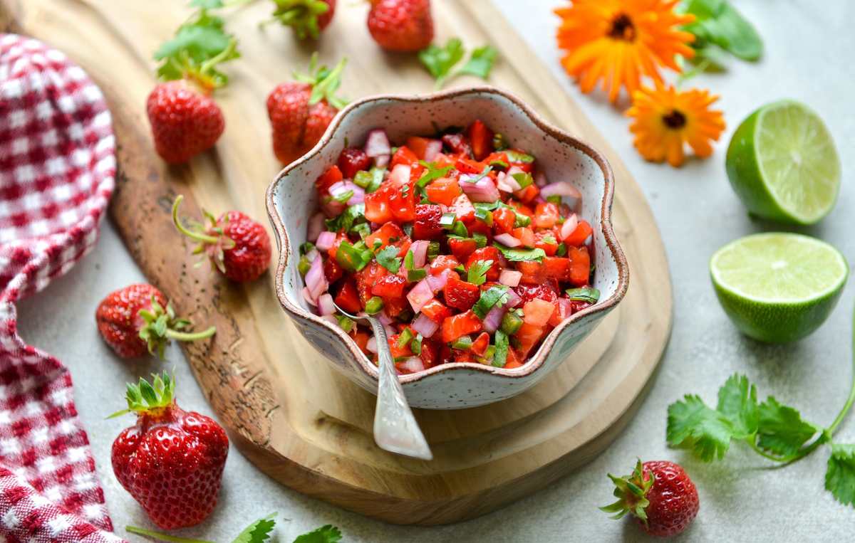 Fresh strawberry salsa with mint leaves, lime, and a dash of chili flakes