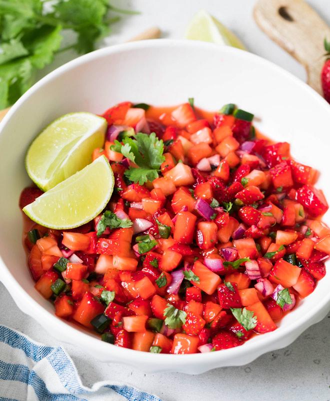 Bright strawberry and pineapple salsa with lime, black pepper, and fresh cilantro