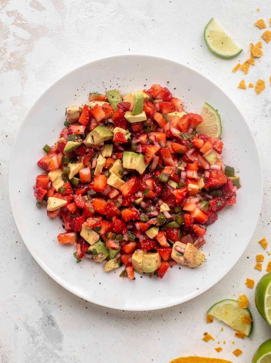 Strawberry avocado salsa with fresh berries, creamy avocado, lime juice, and jalapeño