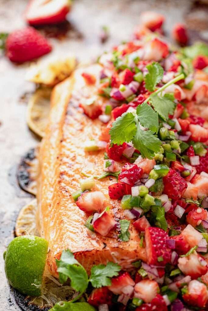 Classic fresh strawberry salsa with diced strawberries, red onion, cilantro, lime, served in a rustic bowl