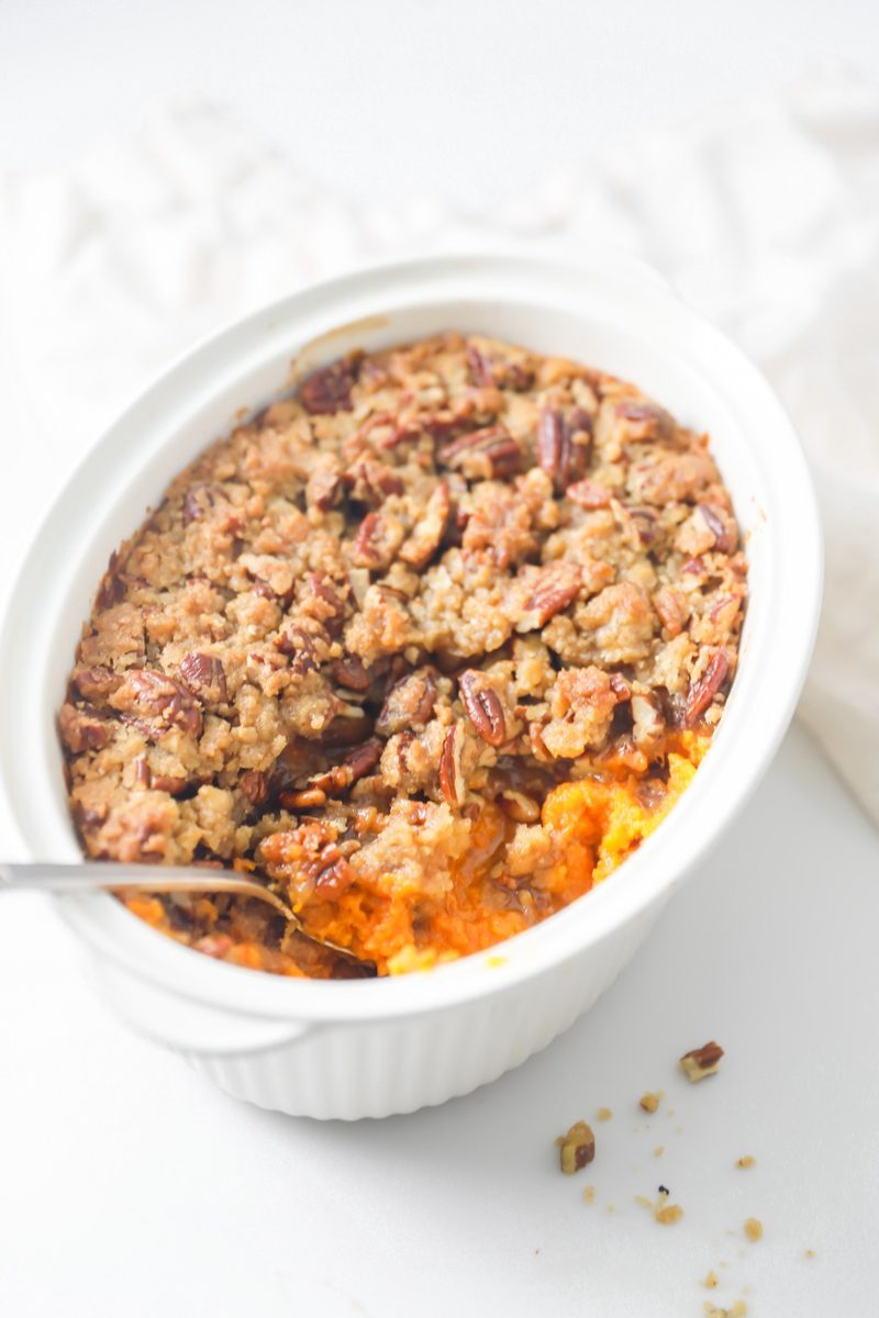 Traditional classic sweet potato casserole with golden edges baked to perfection in casserole dish